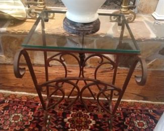 Wrought iron side table, with glass top.