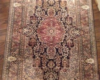 Vintage hand woven silk rug, measures 4' x 6'.