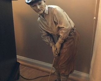 Old style golfer statue