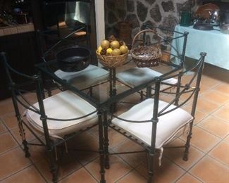 Wrought iron and glass table and chairs