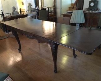 French parquet dining room table with built in extensions. 53” center and leaves 22”, each fold inside the table
