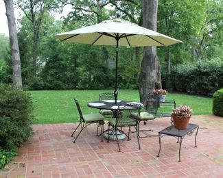 Woodard patio table, four chairs, umbrella with base.  Tea cart and table.  