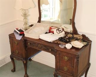 Vanity dressing table shown with purses, hankies, crystal lamp and more.  