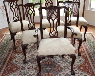 Six dining chairs.  Includes one arm chair or captain's chair.  Shown on hand tied rug.  