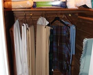 Closet is full of blankets, throws and bedding.  