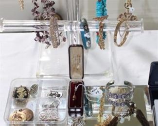 Costume jewelry and a nice gold stick pin.  