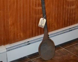 This is a very large and heavy 1765 Revolutionary War, Colonial Army, cannonball iron smelting ladle. It came from the Newark, NJ Museum and is a decommissioned artifact from their display collections, (Museum tag# DA-173.A). The ladle is 41" long and the circular pan is 9" wide. It was used to pour 1 single iron cannonball at a time. It weighs almost 50 lbs. and its in solid condition, ready for display in your collection. It comes with the original Newark Museum tag.