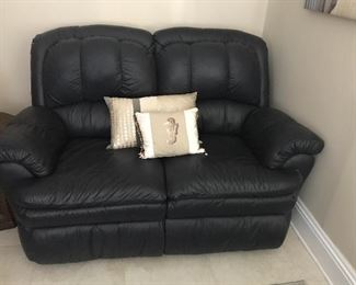 Leather (where you sit) reclining loveseat