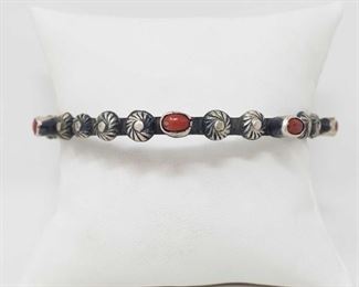 155 Artist Marked Native American Sterling Silver and Coral Stone Bangle Bracelet
Artist Marked Sterling Silver and Coral Stone Bangle Bracelet
Weighs approx 30.4g
Low Estimate: 120.00
High Estimate: 200.00