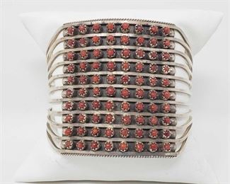 156: Zuni 10 Row Handmade Sterling Silver Coral Bracelet -S. Livingston Bracelet
Zuni 10 row Handmade Bracelet made out Sterling Silver and Coral! Measures: 5-1/4" inside cuff with a 1-1/4" gap.
Weighs approx 39.5g
Low Estimate: 400.00
High Estimate: 600.00