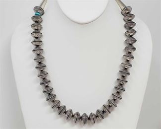 167: Handmade Sterling Silver & Turquoise Necklace made Completely out of Authentic Mercury Dimes
One of a Kind Native American Handmade Sterling Silver and Turquoise Necklace made Completely out of Authentic Mercury Dimes
Weighs approx 182.9g Measures approx 22"
Low Estimate: 1500.00
High Estimate: 2000.00