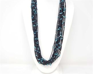 141: Amazing Black Onyx 20 Strand Native American Hand Beaded Necklace with Sterling Silver Clasp
This is a black and turquoise 20 Strand Native American necklace with sterling silver pentagon-etched binding caps and a wide, flat fishhook & eye clasp. A simply beautiful piece of Native American style jewelry, 76.1g.
Low Estimate: 350.00
High Estimate: 500.00