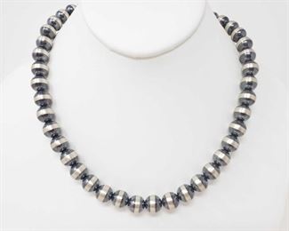 170: Sterling Silver Native American Pawn Bead Necklace, 43.9g
Sterling Silver Native American Pawn Bead Necklace
Weighs approx 43.9g Measures approx 18.5"