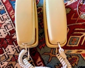 Pair of yellow, vintage phones