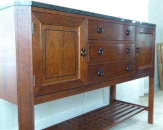 Stickley sideboard with granite top and light that shines onto bottom shelf