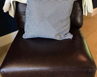 Paired Brown Leather Armless Chairs