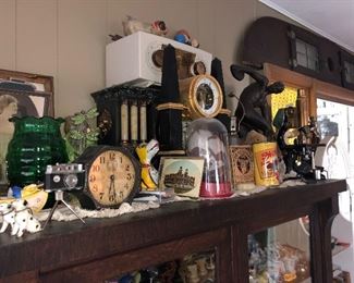 Antique clocks, antique postcards, porcelain dog figures