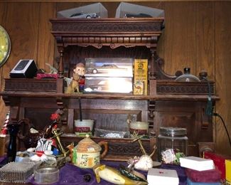 Gorgeous carved mantle, tin toys, fishing collectibles, 