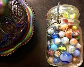 Carnival glass covered dish and jar of vintage marbles