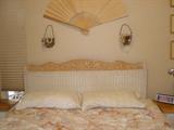 White wicker queen headboard.