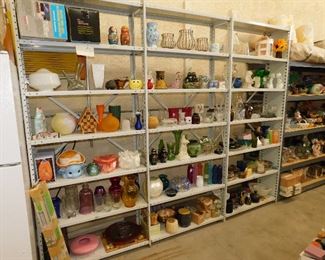 Shelves and shelves of items, all the way around the RV garage. From the front to thee back.