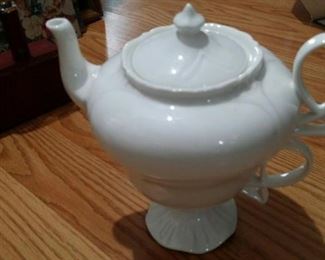 tbs porcelain teapot atop cup set