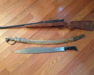 Rifle, sword and machete.