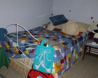Metal full size bed w/old quilt