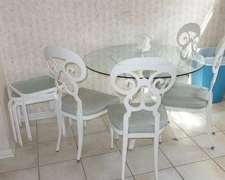 Adorable metal and glass dining table with 4 metal chairs