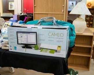 Cameo Silhouette Electronic Cutting Tool! Works great - client just upgraded. A super nice Silhouette bag is sitting behind and can also be purchased.