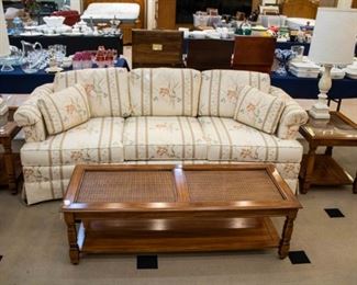 This couch is very clean with highly durable fabric. I love these end and coffee tables. Well made, with a piece of glass on each. They will surprise you!