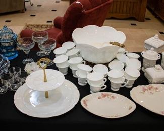 This white milk glass punch bowl set includes 36 cups. The punch bowl is setting on a gold stand - very pretty!