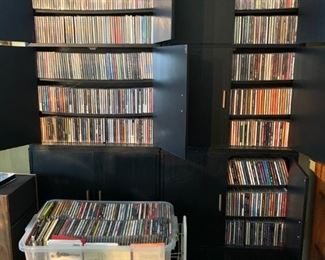 CDs, black storage cabinets 