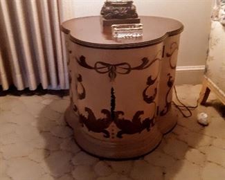 Close-up of lamp table showing off beautiful gold scrolled design.