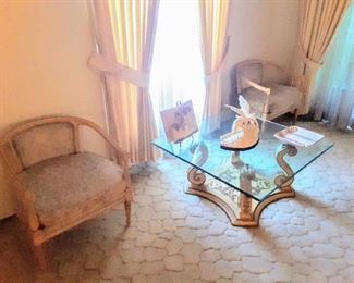 Vinyette of round-back chairs anchoring lovely square shape glass-top coffee table.