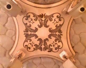 Center lovely gold painted  design of  bottom of coffee table.