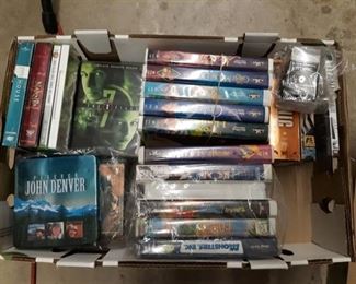 Assorted DVDs And VHS Tapes