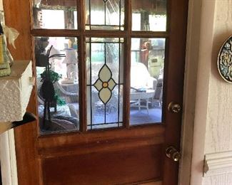 Wood door with beveled stained glass panels