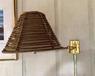 lamp sconce with shade made of kindling sticks