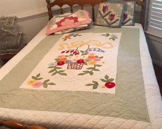 double shaker bed and hand-stitched quilt and pillows