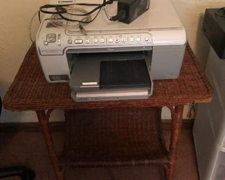 vintage printer on top of side table made of mysterious substance never heretofore mentioned in this listing at all