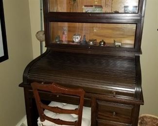 Roll top desk & a two-shelf barrister bookcase.