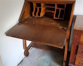Antique Writing desk.  I moved the chair that goes with it because I am not too bright.