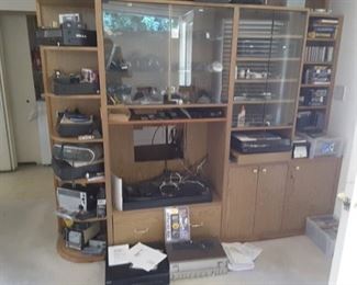 Family Unit filled with Audio Equipment and Radios, Ear Phones, Receivers, Walkmans, DVDS and More.