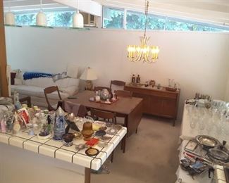 View to the Dining Room, Collection of Collectibles, Glassware, Silver Plated. Dining Room Drexel Heritage Dining Table with 4 Chairs and Matching Drexel Heritage Sideboard for your Dinner Ware.