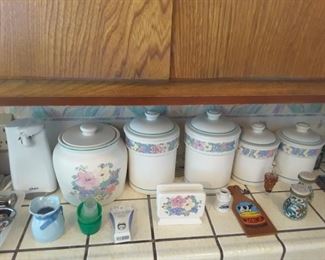 Collection of Flowered 5 Piece Kitchen Set and matching Napkin Holder. Lots of fun collectibles. Can opener.