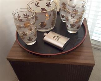 One Bose Speaker, there is a second one in the other corner of the living room. Vintage High Ball Glasses Set and Ice Bucket, small whiskey portable, lazy susan tray.