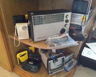 Cassette Player and miniature Radios and Walkmans! Small TV on bottom shelf.