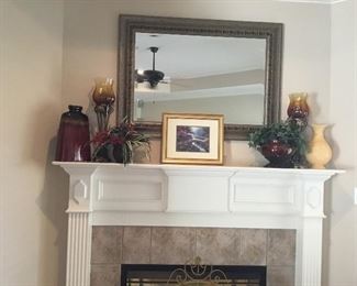 Mirror and decor items over mantle
