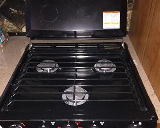Inside of 2017 Jayco Greyhawk 29MV, Ford V10 motor, and12,500 miles - Stove top